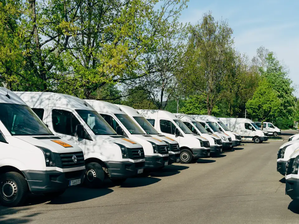 Row of white company vans